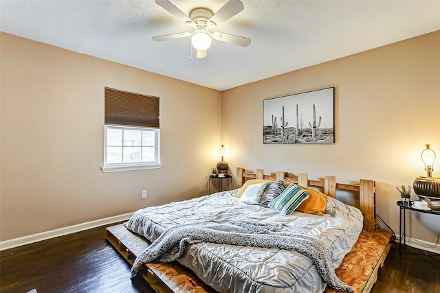 bedroom featuring dark hardwood / wood-style floors and ceiling fan