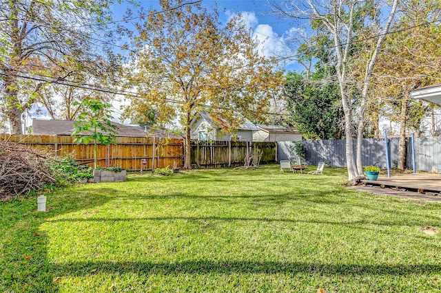 view of yard with a deck