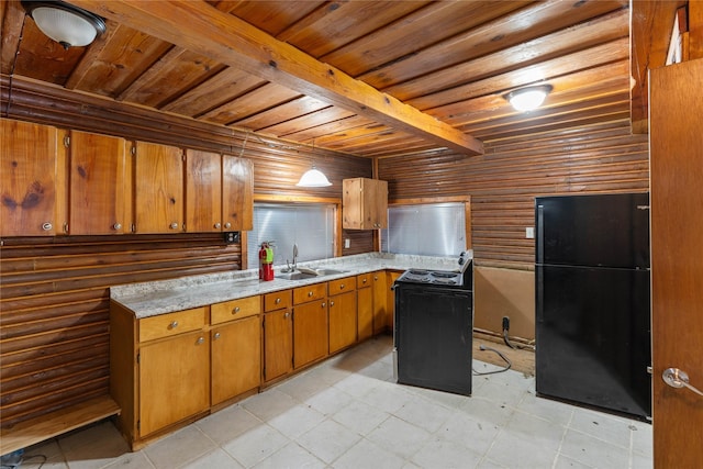 kitchen with black refrigerator, wood ceiling, sink, beam ceiling, and decorative light fixtures