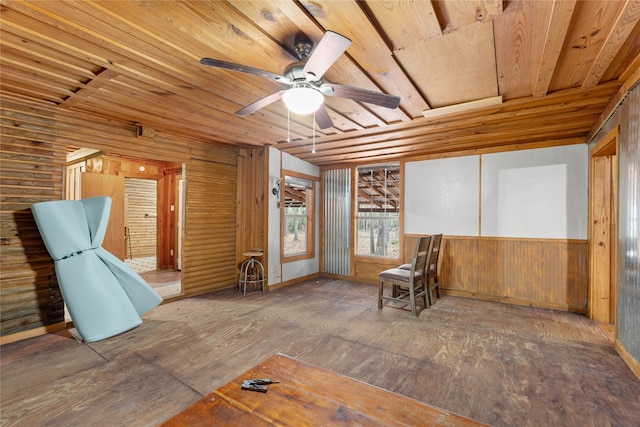 unfurnished room featuring wood walls, ceiling fan, dark hardwood / wood-style floors, and wooden ceiling