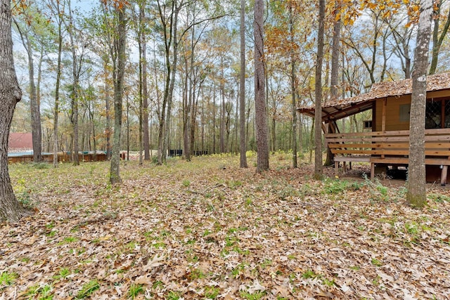 view of yard with a wooden deck