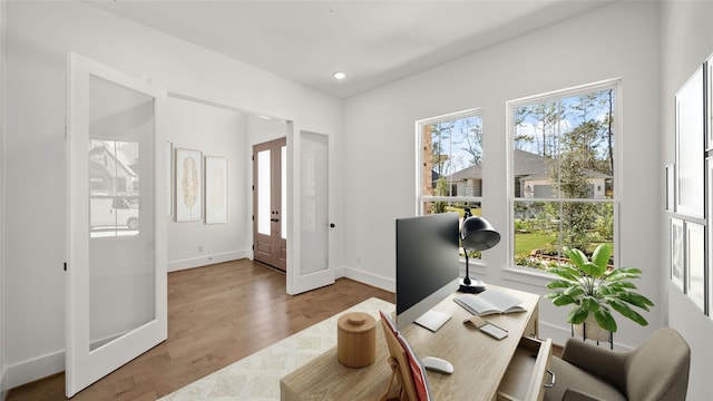 office featuring french doors and hardwood / wood-style floors