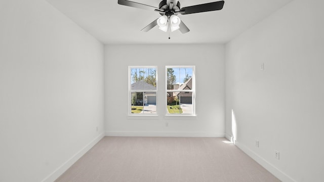 unfurnished room with light carpet and ceiling fan