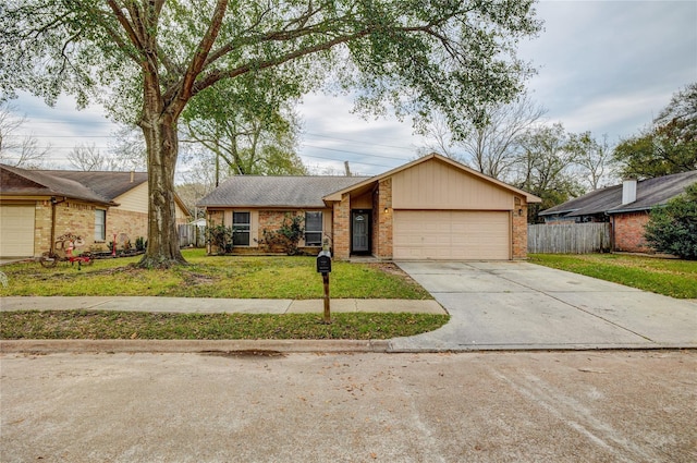 single story home featuring a garage and a front lawn