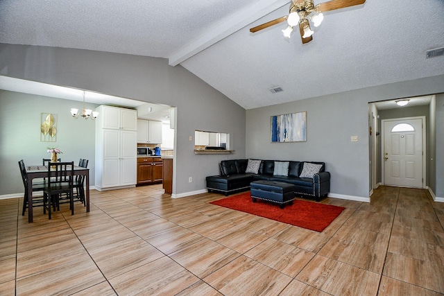 living room featuring ceiling fan with notable chandelier, vaulted ceiling with beams, and a textured ceiling