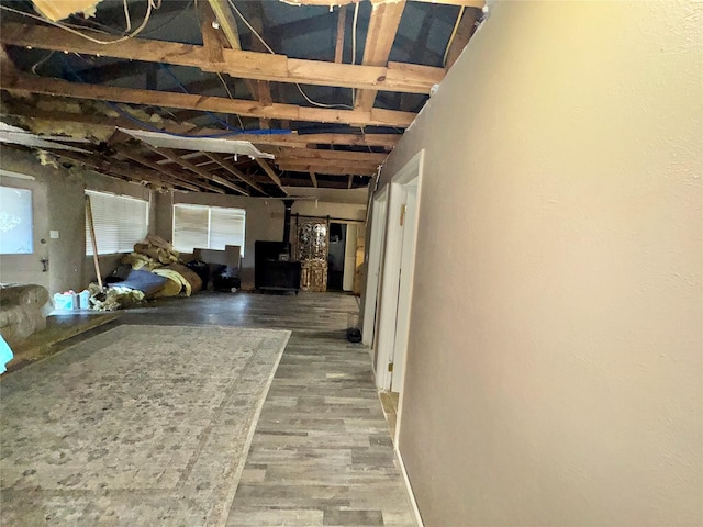 corridor with hardwood / wood-style floors