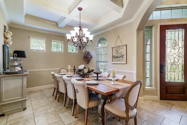 dining room featuring plenty of natural light, ornamental molding, and coffered ceiling