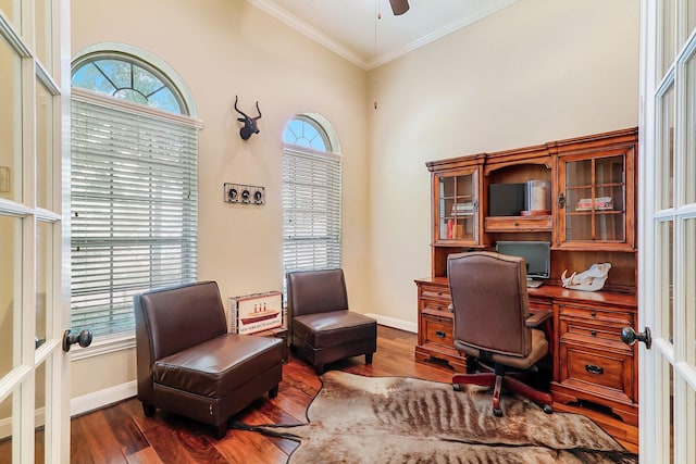 home office with crown molding, french doors, ceiling fan, and dark wood-type flooring