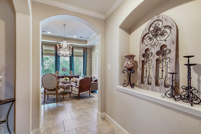 corridor featuring crown molding, a notable chandelier, and light tile patterned flooring