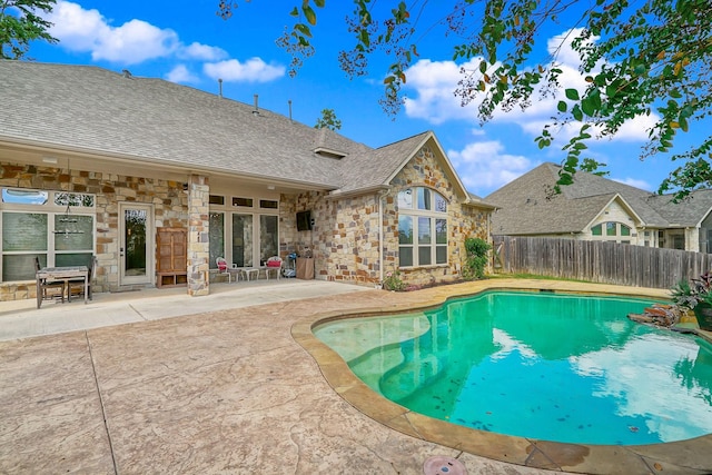 view of swimming pool with a patio area