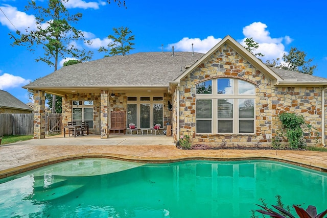 view of swimming pool with a patio