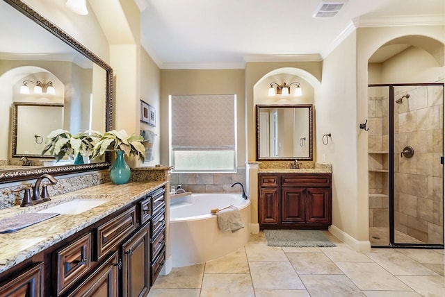 bathroom with tile patterned floors, vanity, ornamental molding, and shower with separate bathtub