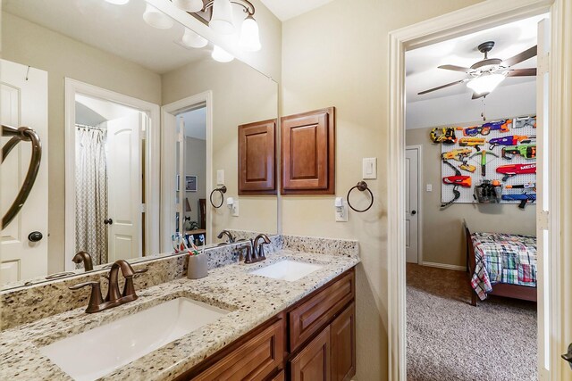 bathroom featuring ceiling fan and vanity