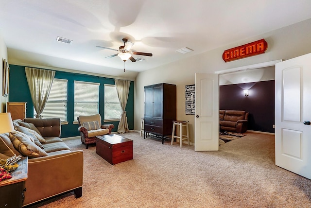 living room featuring ceiling fan and light colored carpet