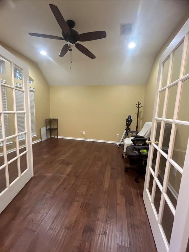 unfurnished office featuring ceiling fan, dark hardwood / wood-style flooring, and vaulted ceiling