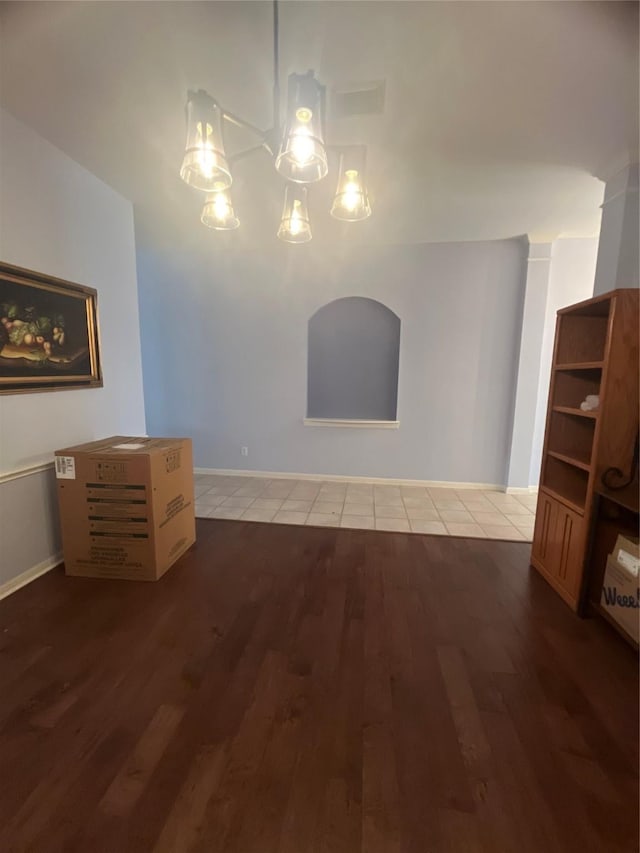 unfurnished living room featuring hardwood / wood-style floors