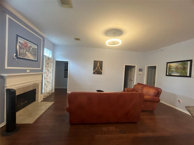 living room featuring a fireplace and dark hardwood / wood-style floors