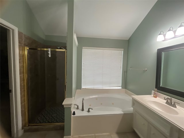 bathroom with plus walk in shower, vanity, and vaulted ceiling