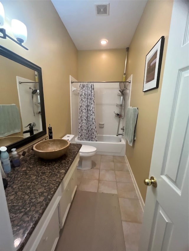 full bathroom featuring tile patterned floors, vanity, shower / bath combo, and toilet