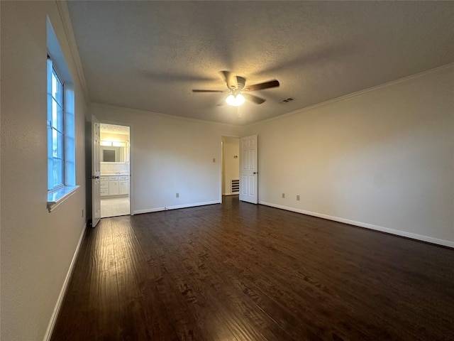 empty room with crown molding, dark hardwood / wood-style flooring, ceiling fan, and a textured ceiling