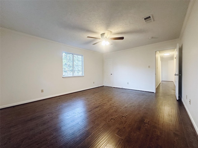 unfurnished room featuring ceiling fan, dark hardwood / wood-style flooring, a textured ceiling, and ornamental molding