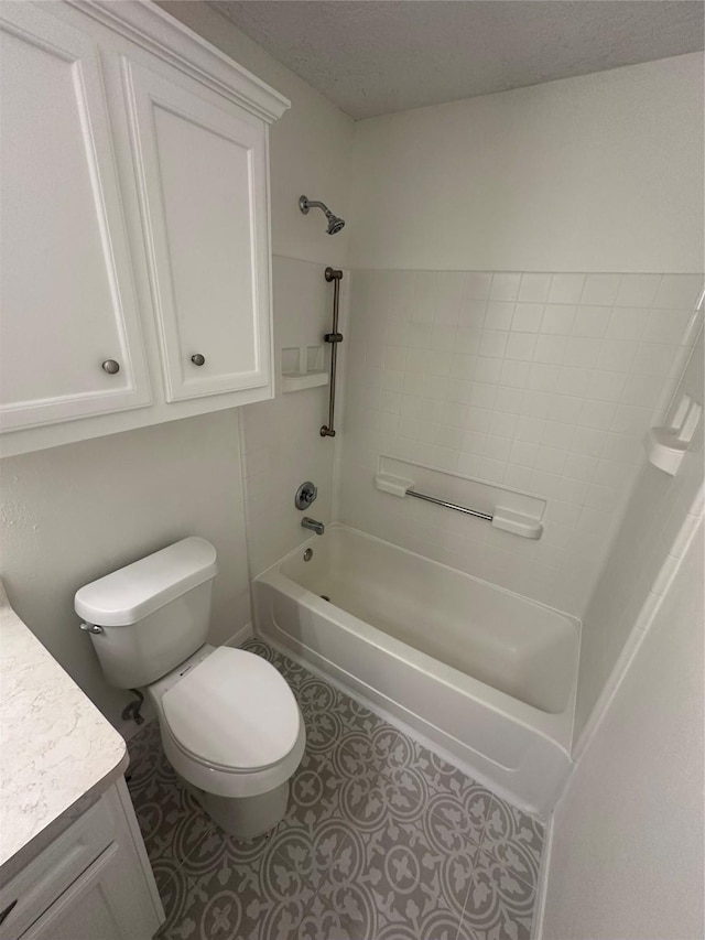 full bathroom featuring a textured ceiling, vanity, toilet, and shower / washtub combination