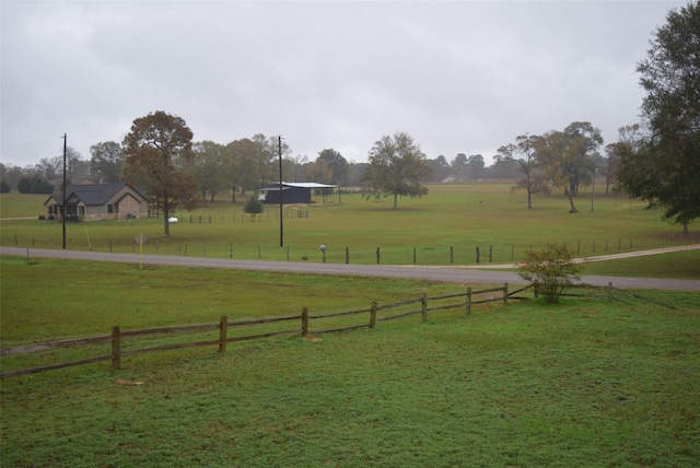 view of yard with a rural view