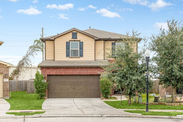 view of front facade with a garage and a front yard