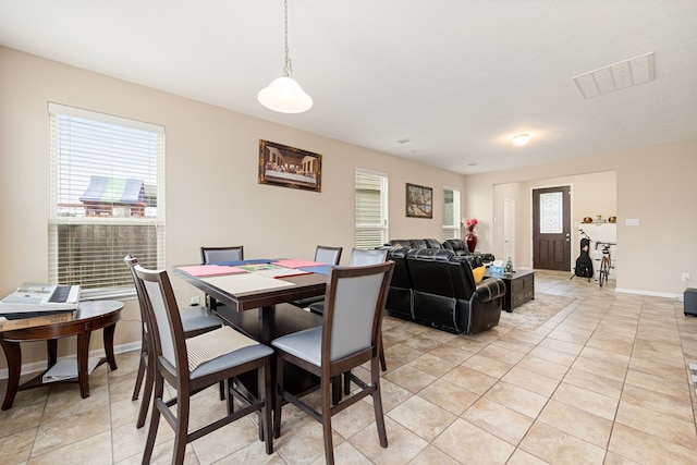 dining room featuring light tile patterned flooring