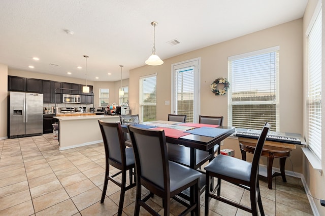 tiled dining area with plenty of natural light