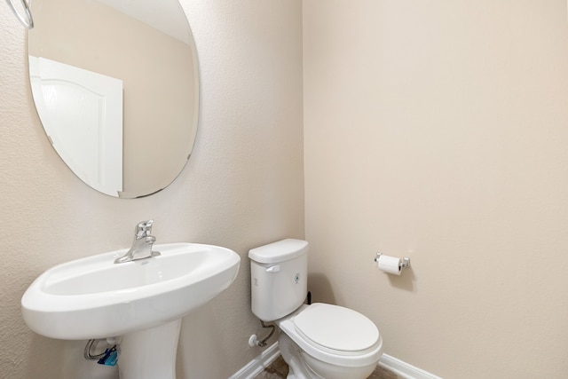 bathroom with toilet and sink