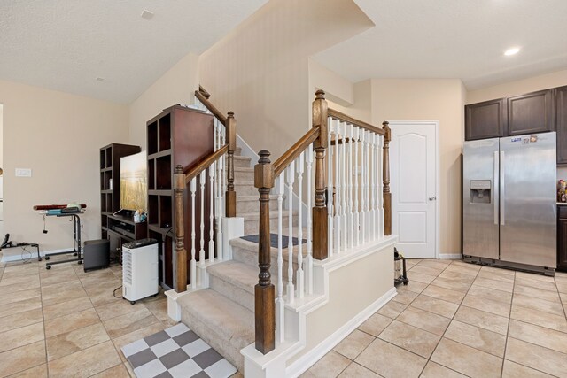 staircase featuring tile patterned floors