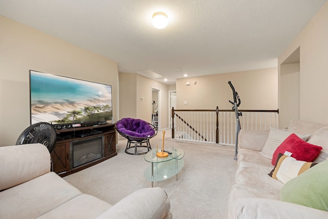 living room with light colored carpet and a textured ceiling