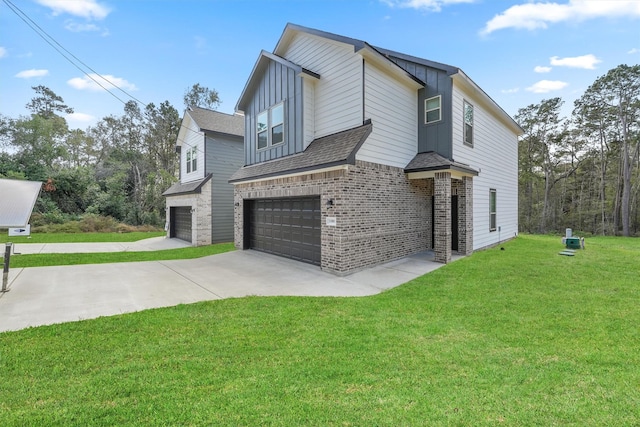 view of front of home with a garage and a front lawn