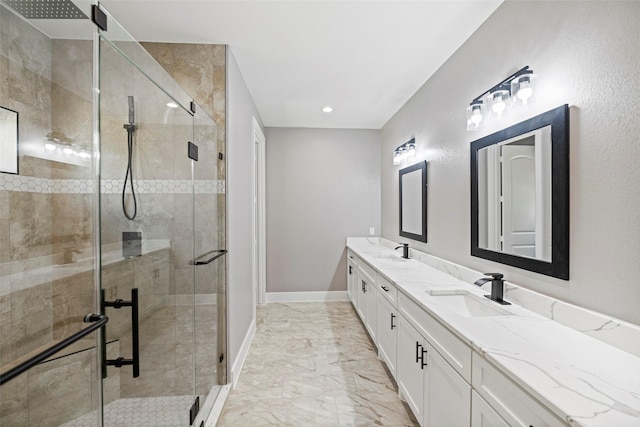 bathroom with vanity and a shower with shower door