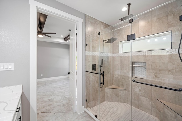 bathroom with ceiling fan, vanity, and an enclosed shower