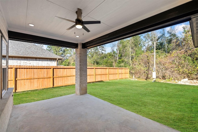 view of yard with a patio and ceiling fan