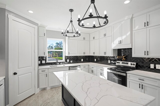 kitchen with pendant lighting, sink, white cabinetry, and stainless steel appliances