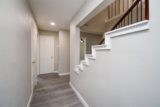 corridor with hardwood / wood-style floors