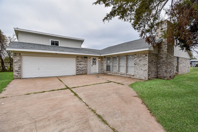 view of front of property with a garage and a front yard