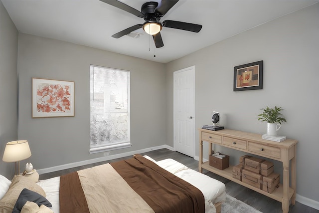 bedroom featuring dark hardwood / wood-style floors and ceiling fan