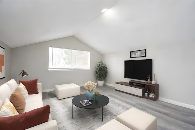 living room with lofted ceiling and light wood-type flooring