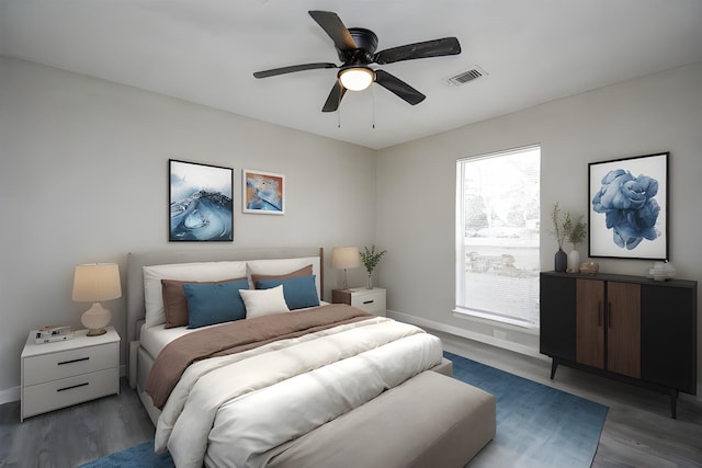 bedroom featuring ceiling fan and dark hardwood / wood-style floors