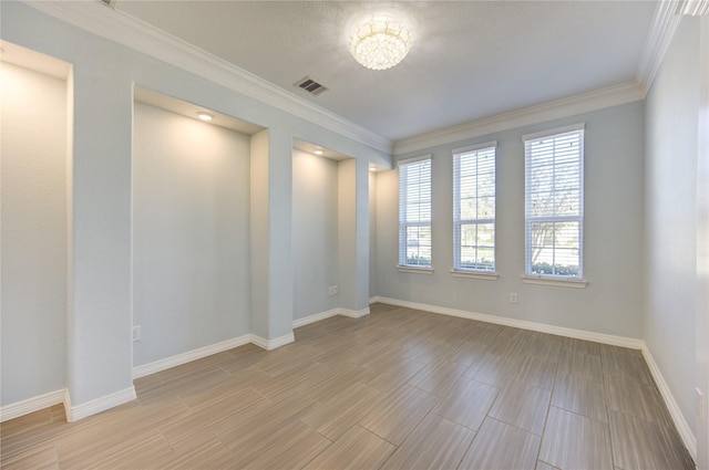 unfurnished room with an inviting chandelier and crown molding