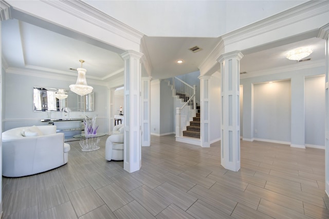 unfurnished living room featuring ornamental molding and a chandelier