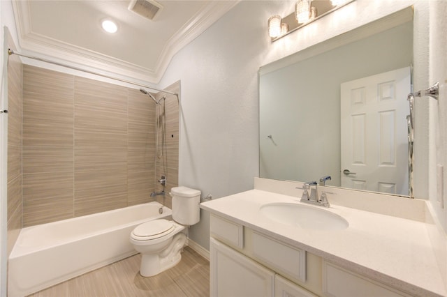 full bathroom featuring vanity, toilet, ornamental molding, and tiled shower / bath