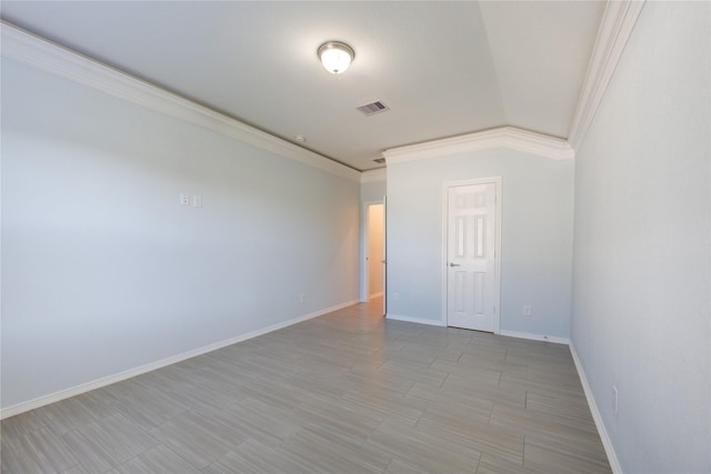 spare room featuring ornamental molding