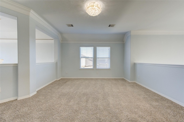 unfurnished room with carpet, crown molding, and a chandelier