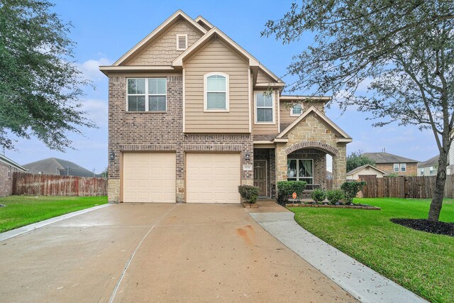 view of front of home featuring a garage and a front yard