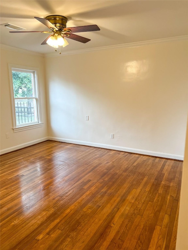 spare room with hardwood / wood-style flooring, ceiling fan, and ornamental molding